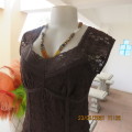 Attractive choc brown lined top with tiny capped sleeves. Size 34/10. For day/evening wear. New cond