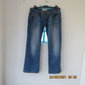 High quality Men`s BUCCELLI blue denim jeans. Size 34 in stretch cotton. Low rise. Bootcut. New cond
