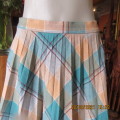 Check-mate ! Size 38/14 A TERSEL GARMENT.Concertina pleated jade/cream check.Polyester.
