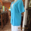 Smart sky blue summer jacket with V neck close with 2 buttons.Loose size 38/14 no label. New cond.
