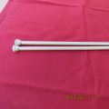 Pair of size 7mm knitting needles by AERO from England. As new.