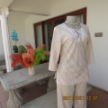 High quality slip over beige top by NEWS size 34/10 in diagonal stripes.In textured polyester/rayon