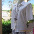 Beautiful short sleeve button down white top with cotton lace both sides.Size 36/12.Shirt collar.
