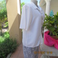 Beautiful short sleeve button down white top with cotton lace both sides.Size 36/12.Shirt collar.