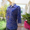 New blue patternened slip over stretch polyester top. Short front zip and embellished collar.Size 36
