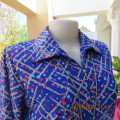 New blue patternened slip over stretch polyester top. Short front zip and embellished collar.Size 36