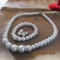 Fabulous new set of pearl necklace, stretch bracelet and piercing earrings.Length of necklace 49cm.