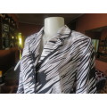 Amazing broken diagonal striped top/jacket size 36/12 in grey/white/black.Black sheer edging,New con