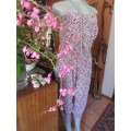 Chic ladylike strapless jumpsuite in fine floral cotton with pink accents.Side pockets.Size 32 to 34