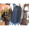 Go feminine with this sleeveless black acrylic lace slip over top.Underlay in stretch poly.Size 36