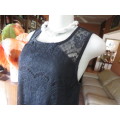 Go feminine with this sleeveless black acrylic lace slip over top.Underlay in stretch poly.Size 36