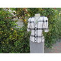 Cute large black/white check short sleeve cropped top.V neck and button down.Size 34 by FOSHINI