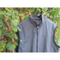 Men`s grey nylon sleeveless waistcoat with black poly mesh inner. Zip up front and pockets.Size XL