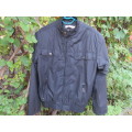 Men`s black SIR-J long sleeve zip up jacket size Medium.Nylon outer,polyester inner.High collar.