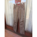Shiny olive green skinny pants with back/front pockets. Faux diamond decoration. For 13/14 yr old.