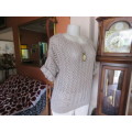 Up the lux with this acrylic/nylon knit top in lace pattern.Chic short sleeves. By TRUWORTHS size 38