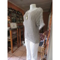 Up the lux with this acrylic/nylon knit top in lace pattern.Chic short sleeves. By TRUWORTHS size 38