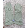 Absolute stunning pair of light avo colour vintage gloves in 100% nylon with some stretch.Size 7.5.