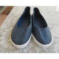 Pair of navy flat shoes in size 2 by (andUS) sold by WOOLWORTHS. Uppers PU. As new condition.