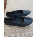 Pair of navy flat shoes in size 2 by (andUS) sold by WOOLWORTHS. Uppers PU. As new condition.