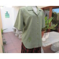 Avo green box style short sleeve Boutique made top with button down and open collar.Size 44/20.
