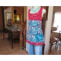 Delightful long navy top with maroon bust area. With Afrikaans logos and pictures.Size 34.As new