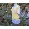 Adorable acrylic lace long empire cross over top in yellow and cream with strappy top.Size 38/14.