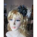 Dramatic black satin bendable hairband with black/white feathery flower at side.With black beads.New