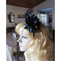 Dramatic black satin bendable hairband with black/white feathery flower at side.With black beads.New