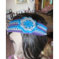 Pretty crochet acrylic hairband in purple/grey/blue stripes with flower.Purple braiding ties at back