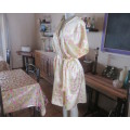 As new vanilla yellow silkyfold over night gown with pink/white flowers.Tiny cut-on sleeves.Size 42