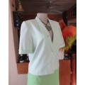 Gorgeous mint green cropped short sleeve jacket/top. Close with 2 buttons.Fully lined.Size 34/10.