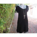 Irresistible black viscose stretch long top/short dress in 32/8 Capped sleeves.Frilled neck/hemline