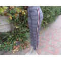 Monochrome check skinny leg stretch polyester pants with maroon accent stripes. Size 32/8 by FIX.New