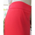 Smart red pencil skirt in red jersey fabric with some stretch.Size 42/18. Pleat at back. As new.
