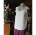 Cream cami style slip over silky polyester top by CONTRADICT size 36/12. Slits at sides.Scooped neck