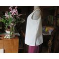 Cream cami style slip over silky polyester top by CONTRADICT size 36/12. Slits at sides.Scooped neck