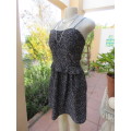 Sweet black wash and wear polyester strappy dress with white masks print,Size 38/14.As new.