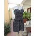 Sweet black wash and wear polyester strappy dress with white masks print,Size 38/14.As new.
