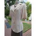 Classic tailored cream short sleeve top/jacket.Button down with open embroidered collar.Size 36/12.