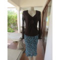 Choc brown stretch viscose slip over top.See through long sleeves.V neck.Diamond shape decor.Size 38