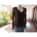 Choc brown stretch viscose slip over top.See through long sleeves.V neck.Diamond shape decor.Size 38