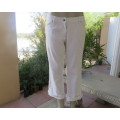 White ankle length bootlegged pants. In polycotton. Size 40/16 by RE.Pockets galore.Good cond.