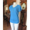 As new soft teal colour V neck slip over top.Short cut-on decorated sleeves.Yoked.Size 34/10.