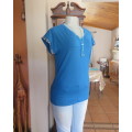 As new soft teal colour V neck slip over top.Short cut-on decorated sleeves.Yoked.Size 34/10.