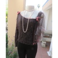 Glamour soot black stetch lace with netting overlay top.One sleeve/one strap.Size 38 by RIMODA.