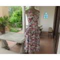 Button down sleeveless dress in white polycotton with colourful flowers.By FOSHINI size 32/8.