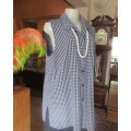 Casual black/white check sleeveless button down top with open collar. One pocket.Size 42 by ASPIRE