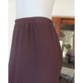 Beautiful choc brown gored stretch polyester skirt with elasticated waist. By AUDACITY size 44/20.