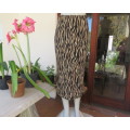Striking maxi tube style skirt in cream/brown animal print.Elasticated waist. Size 34/10.As new.